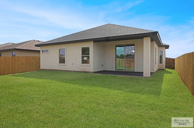1838 Miley Ln, Harlingen, TX 78550 - back of house featuring a fenced backyard and roof with shingles