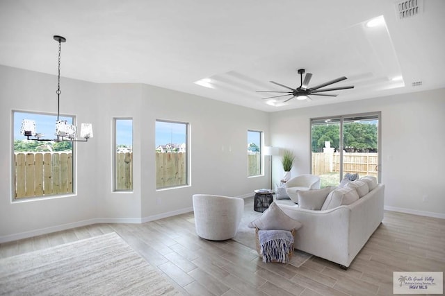 1838 Miley Ln, Harlingen, TX 78550 - living area with a chandelier, light wood-style floors, and ceiling fan