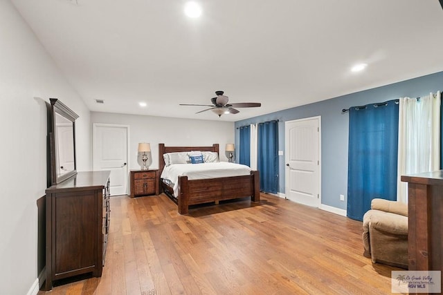 bedroom featuring ceiling fan and light hardwood / wood-style flooring