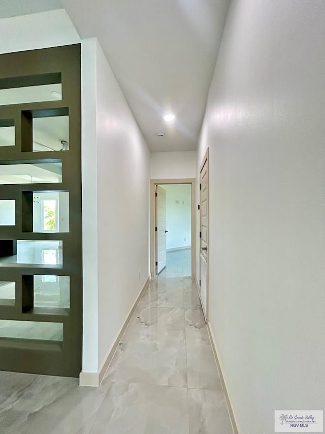 514 Oriole Dr, Los Fresnos, TX 78566 - corridor featuring baseboards and marble look tiles