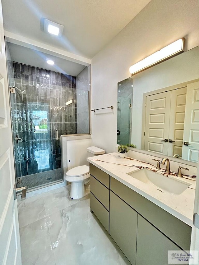 514 Oriole Dr, Los Fresnos, TX 78566 - bathroom with vanity, a stall shower, and marble finish floors