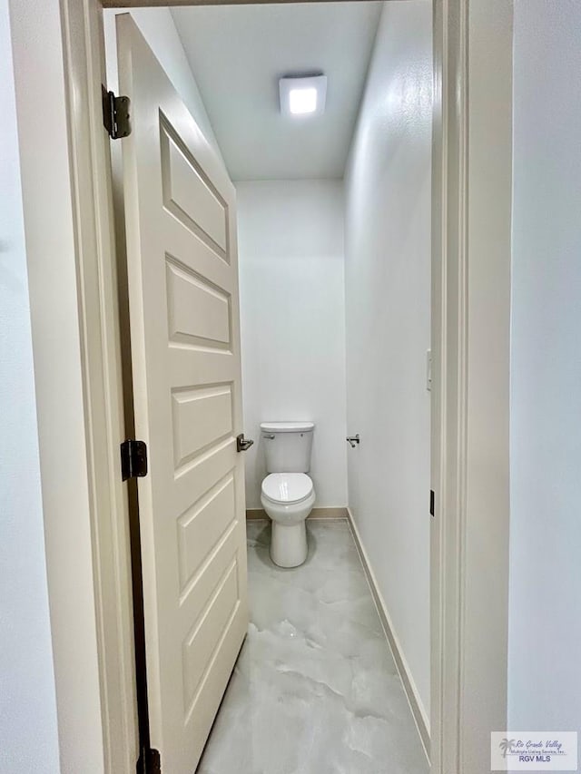 514 Oriole Dr, Los Fresnos, TX 78566 - bathroom with toilet and concrete flooring