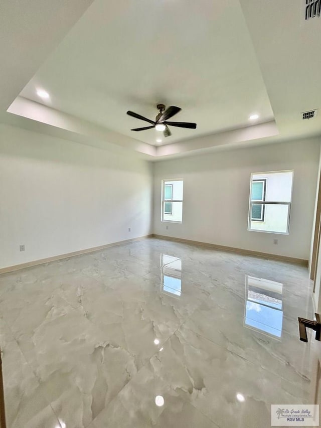 514 Oriole Dr, Los Fresnos, TX 78566 - empty room with a raised ceiling, ceiling fan, and recessed lighting
