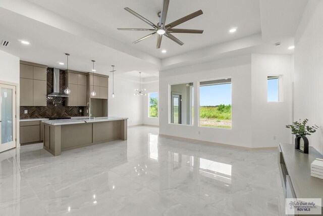 514 Oriole Dr, Los Fresnos, TX 78566 - unfurnished living room with a tray ceiling, ceiling fan, recessed lighting, and light marble finish floors