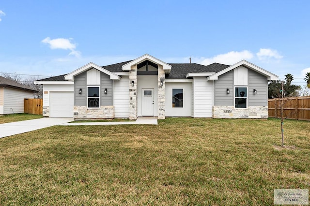 view of front of home featuring a garage and a front lawn