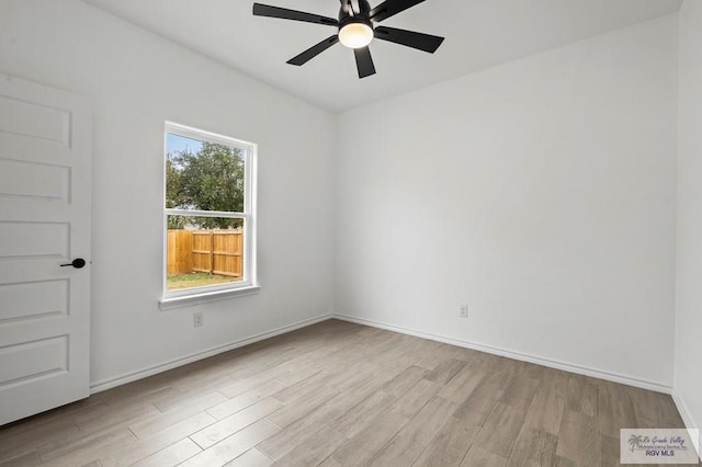 spare room with light hardwood / wood-style flooring and ceiling fan