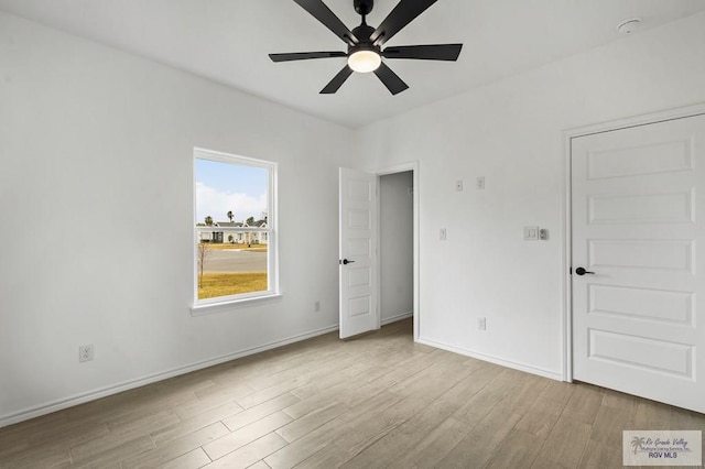 unfurnished bedroom featuring light hardwood / wood-style floors and ceiling fan