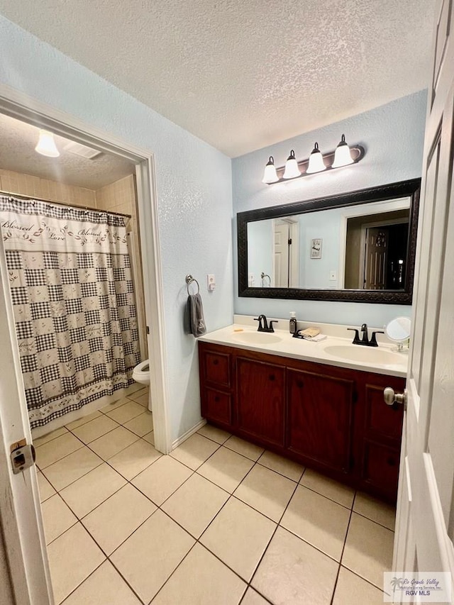 31360 Fm 1575, Los Fresnos, TX 78566 - bathroom with double vanity, a textured ceiling, tile patterned floors, a textured wall, and a shower with shower curtain