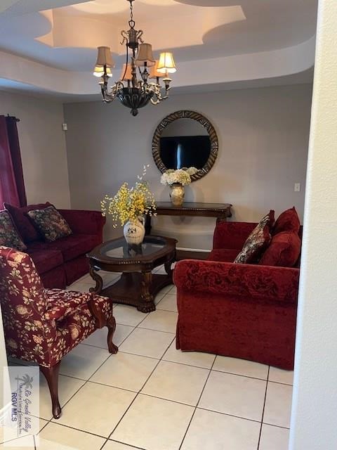 living room with a notable chandelier and light tile patterned flooring