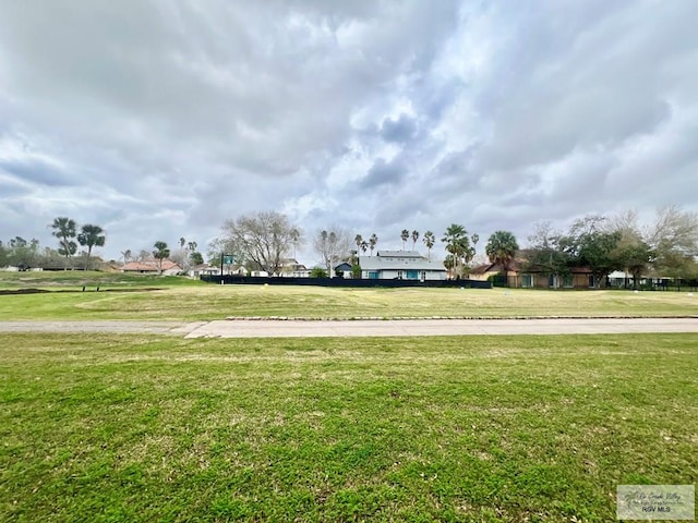 view of home's community with a lawn