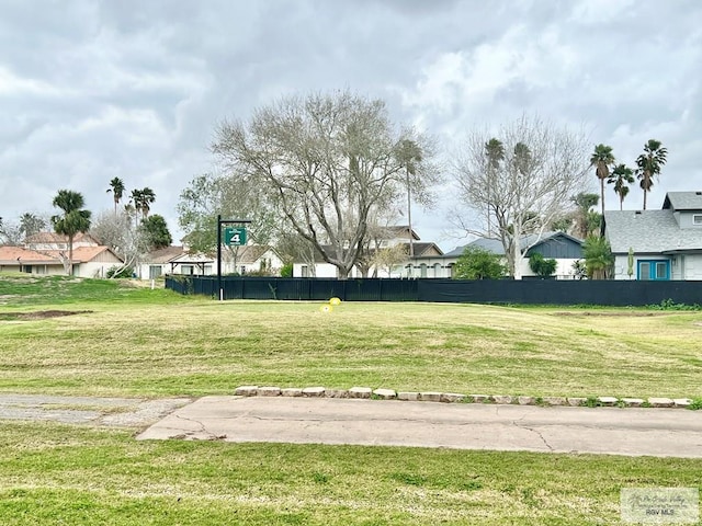 view of community featuring a residential view and fence