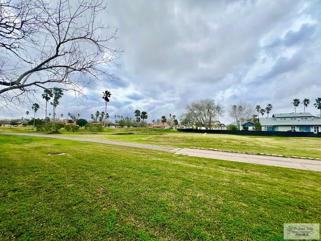 view of home's community featuring a lawn