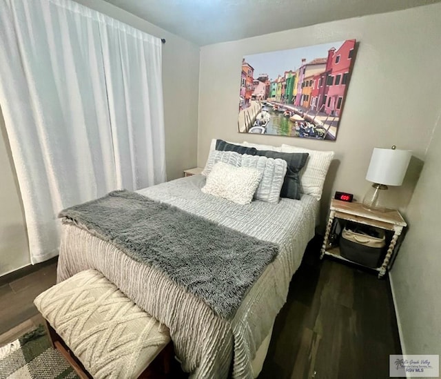 bedroom featuring dark wood-type flooring