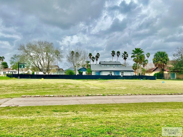 view of community with fence