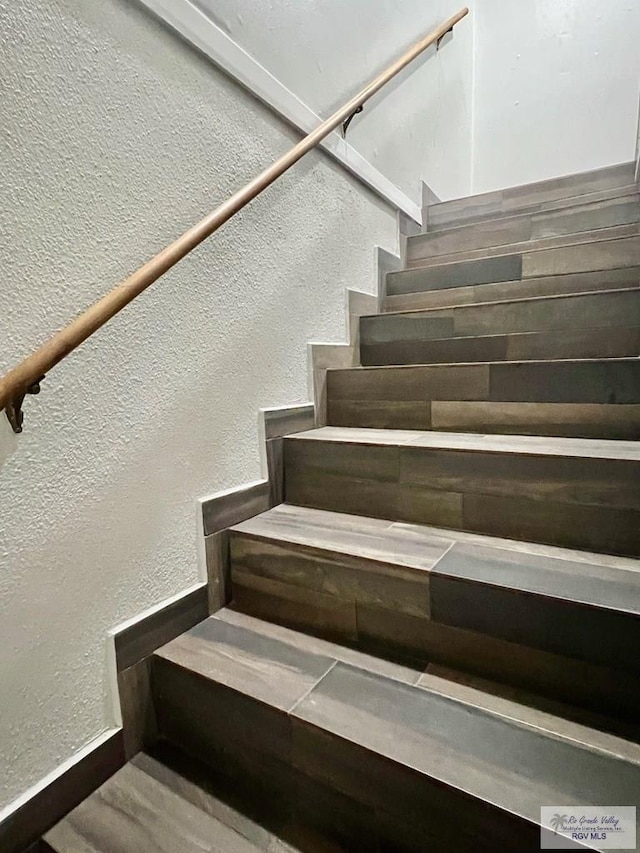 stairway with a textured wall