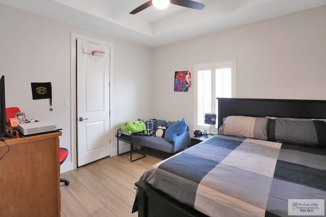 bedroom featuring light wood-type flooring and ceiling fan