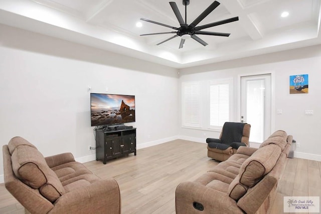 living room featuring beam ceiling, ceiling fan, light hardwood / wood-style floors, and coffered ceiling