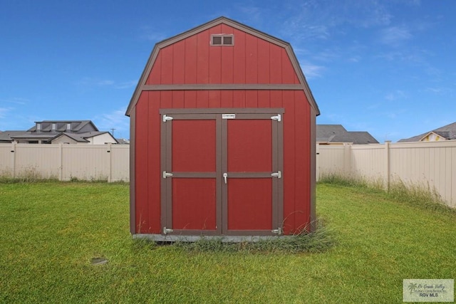 view of outdoor structure with a lawn