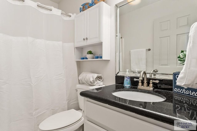 106 E Campeche St Unit A2, South Padre Island, TX 78597 - full bath with vanity, toilet, and a shower with shower curtain