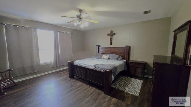 bedroom featuring ceiling fan and dark wood-type flooring