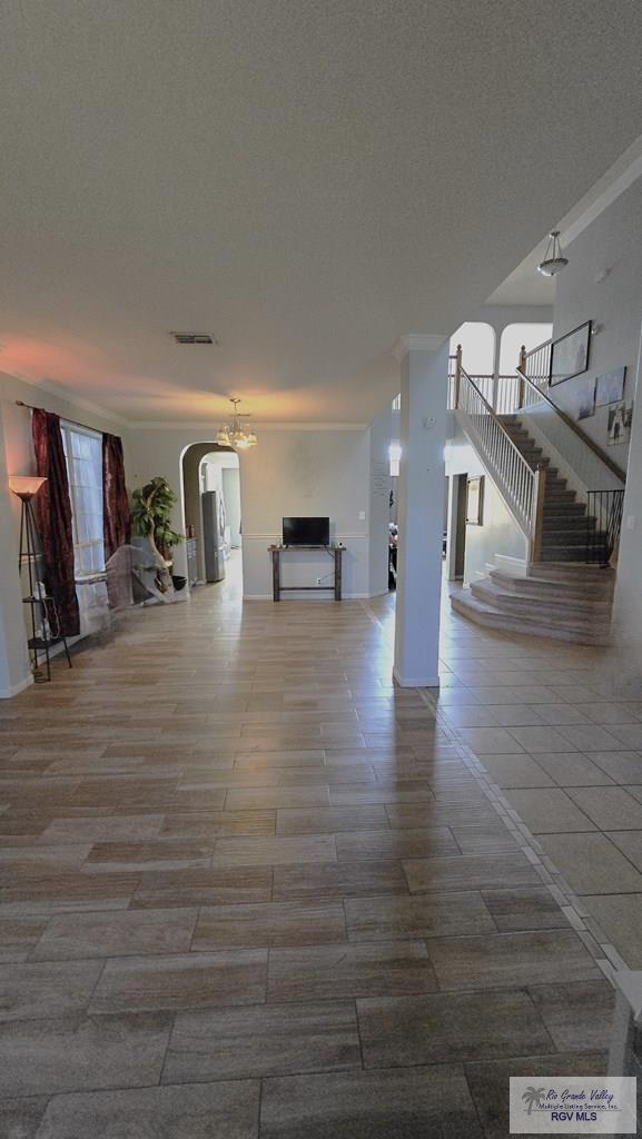 unfurnished living room with a textured ceiling