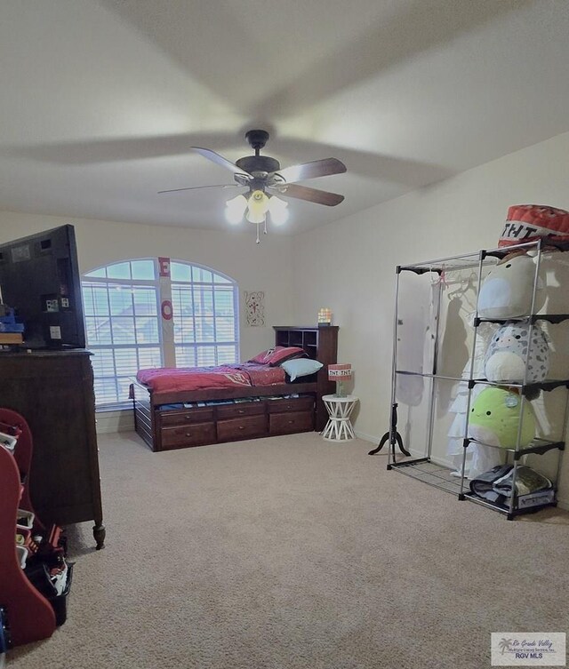 carpeted bedroom featuring ceiling fan