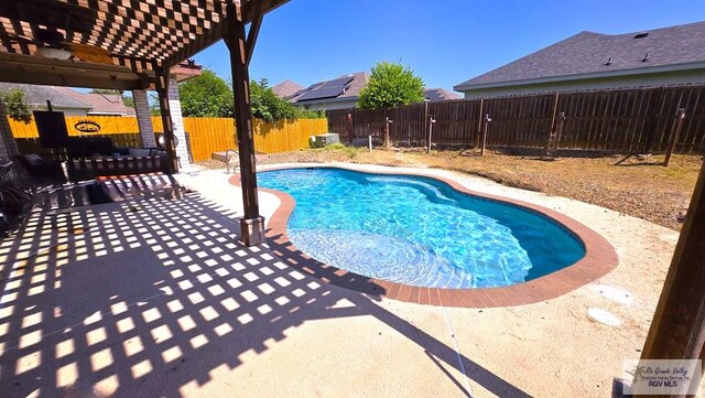 view of swimming pool featuring a pergola and a patio