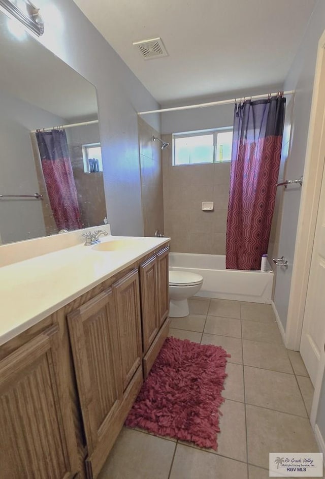 full bathroom with tile patterned flooring, vanity, toilet, and shower / tub combo