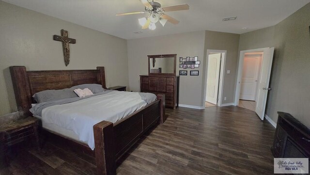 bedroom featuring dark hardwood / wood-style floors and ceiling fan