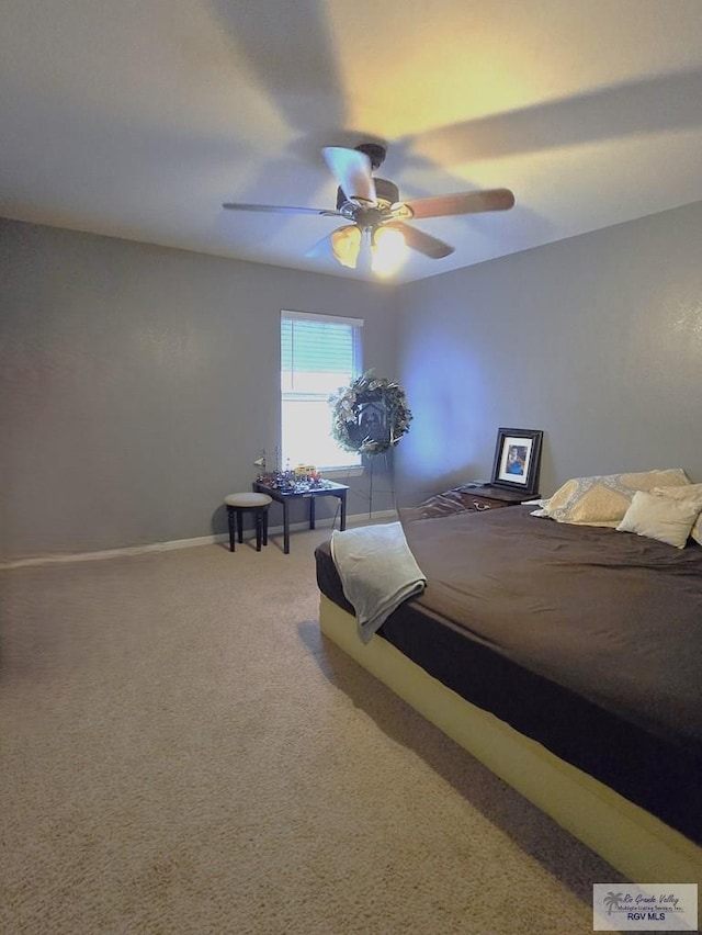 bedroom with ceiling fan and carpet floors