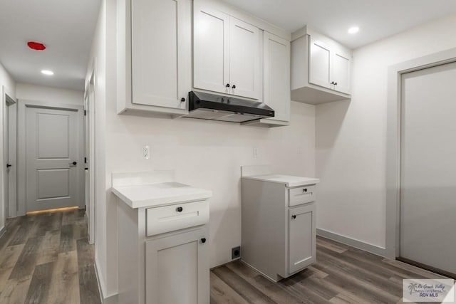 kitchen with white cabinets and dark hardwood / wood-style floors