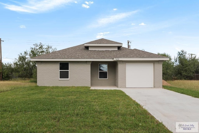 ranch-style home with a front lawn and a garage