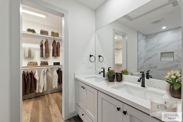 bathroom featuring hardwood / wood-style flooring and vanity