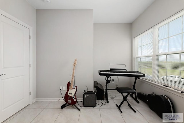 miscellaneous room featuring light tile patterned floors and baseboards