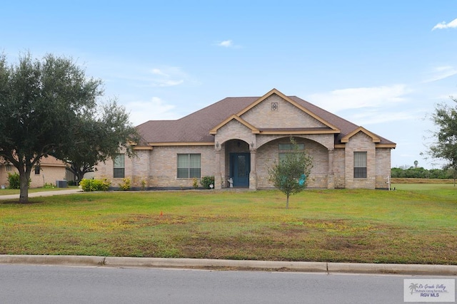 ranch-style house with a front lawn