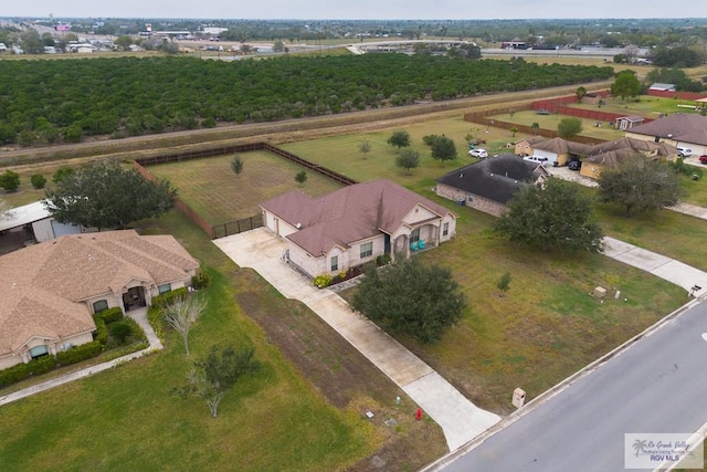 birds eye view of property with a rural view