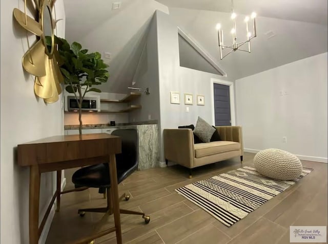 interior space with lofted ceiling and a notable chandelier