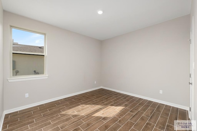 empty room featuring dark wood-type flooring