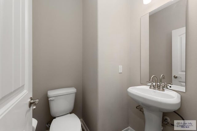 bathroom featuring sink and toilet