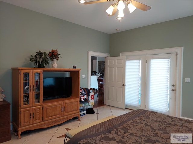 tiled bedroom with ceiling fan