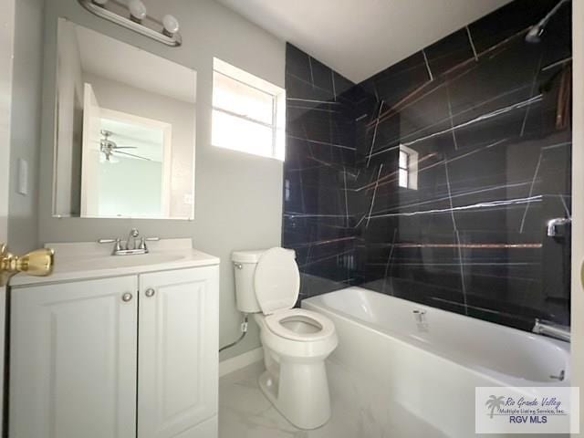 full bathroom featuring toilet, vanity, baseboards, marble finish floor, and tub / shower combination