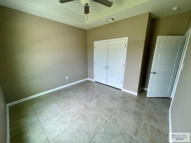 unfurnished bedroom with a closet and ceiling fan