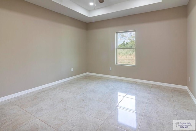 unfurnished room with ceiling fan and light tile patterned floors