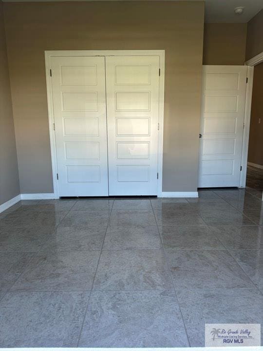 unfurnished bedroom featuring a closet