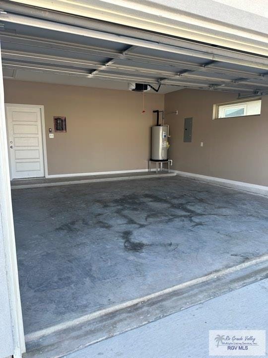 garage featuring electric panel, water heater, and a garage door opener