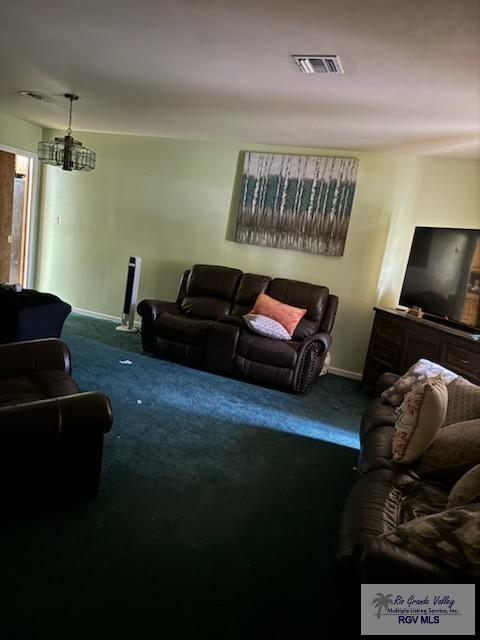 624 Waterside Dr, Brownsville, TX 78521 - living room featuring carpet flooring