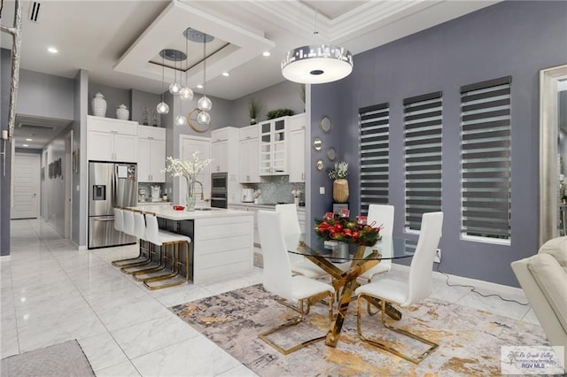 dining space featuring a high ceiling, light marble finish flooring, and recessed lighting