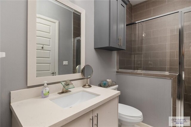 bathroom featuring toilet and vanity
