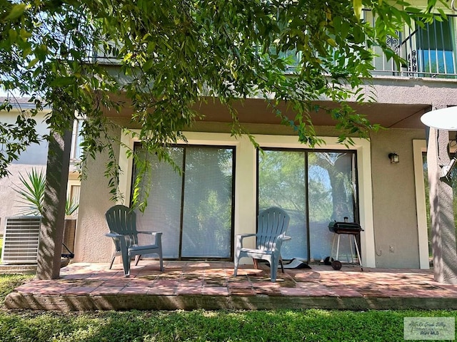 back of property with a patio