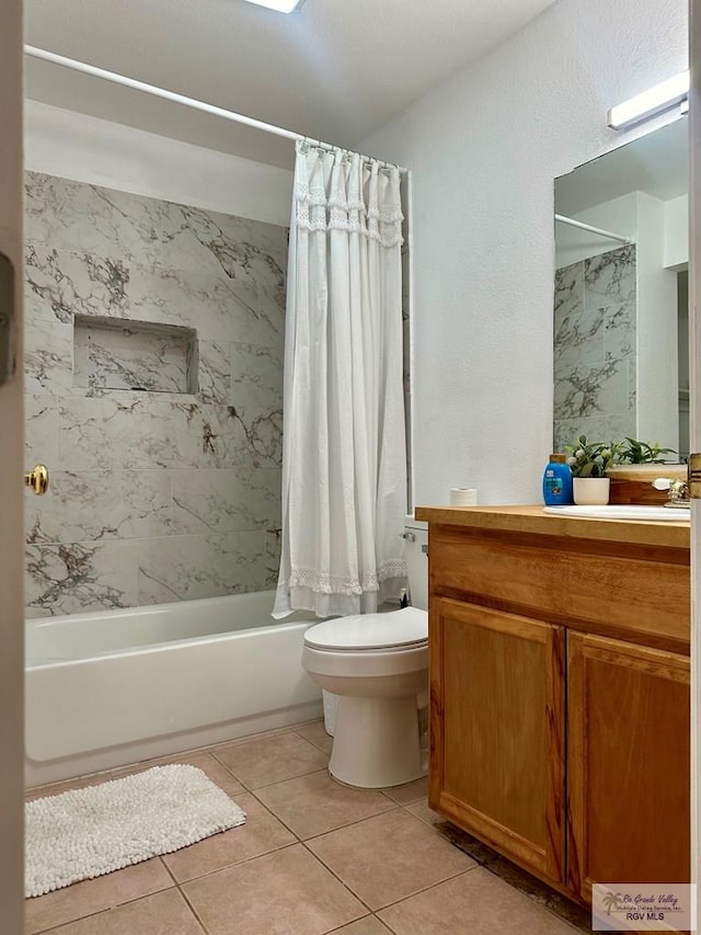 full bathroom featuring tile patterned floors, shower / bath combination with curtain, toilet, and vanity